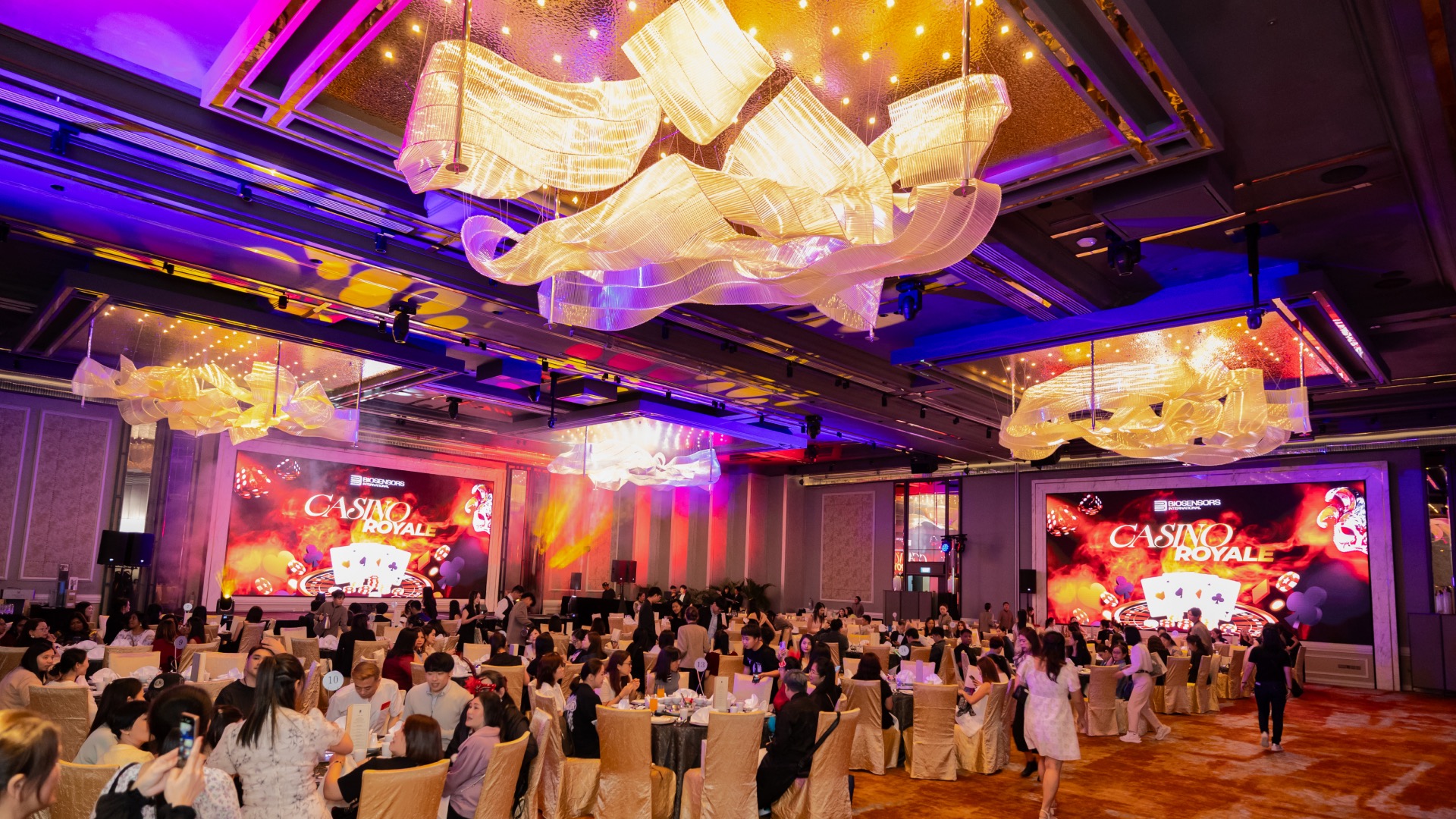 Dinner and dance event Singapore with dramatic themed stage setup and elegant decor