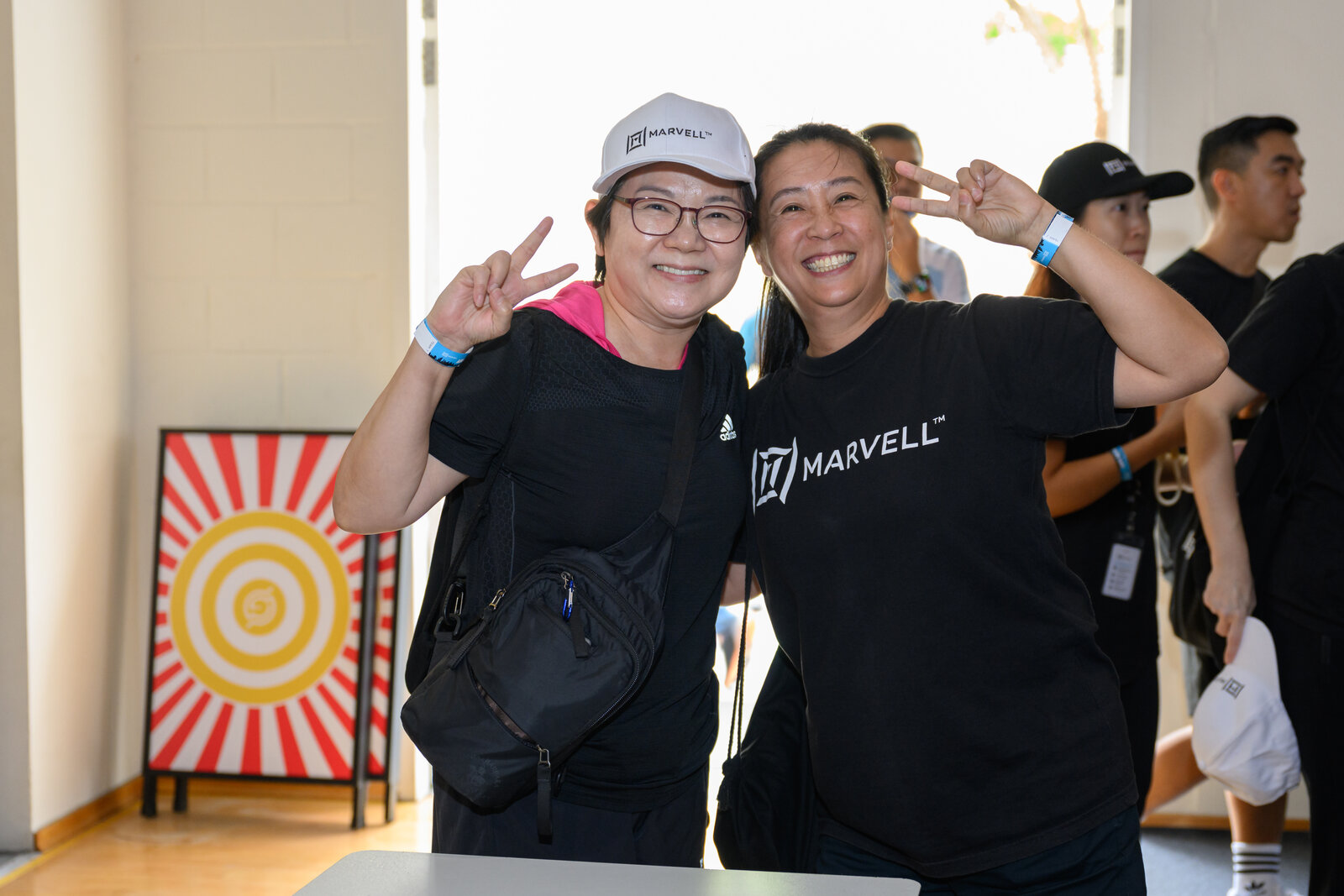 Corporate Amazing Race Singapore participants celebrating at challenge station