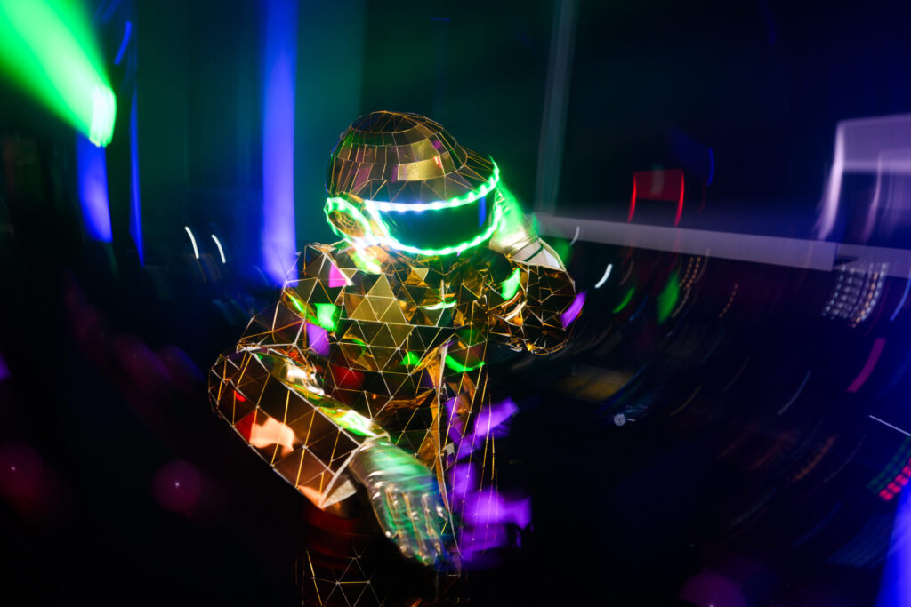 Gold mirror-suit robot performer with LED lighting at a corporate gala dinner in Singapore