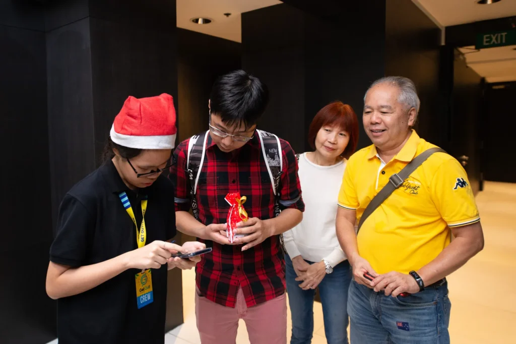 Guests participating in a festive activity at a corporate Christmas party in Singapore