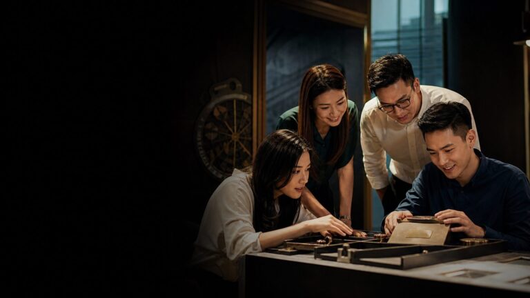 Corporate team solving puzzles in a modern escape room