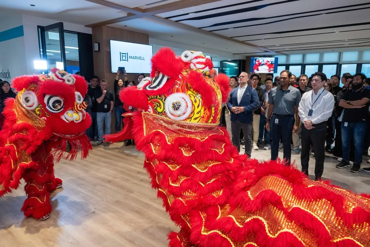 Guests watching a lion dance at an office opening celebration
